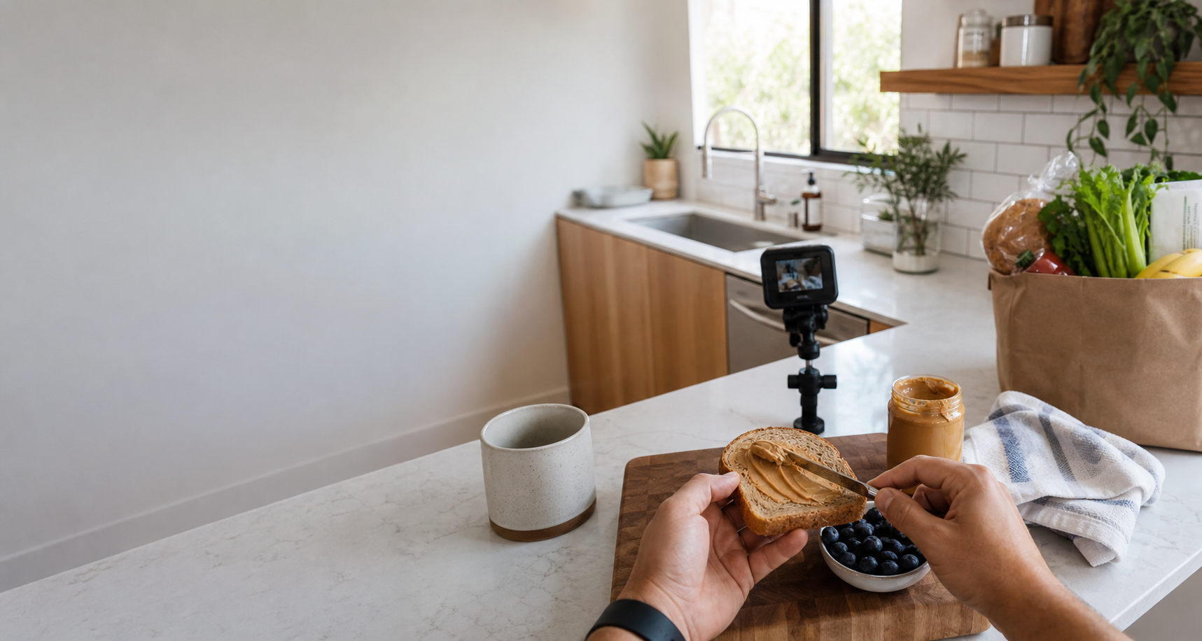 First-person breakfast preparation in a bright kitchen with a small camera visible on the counter